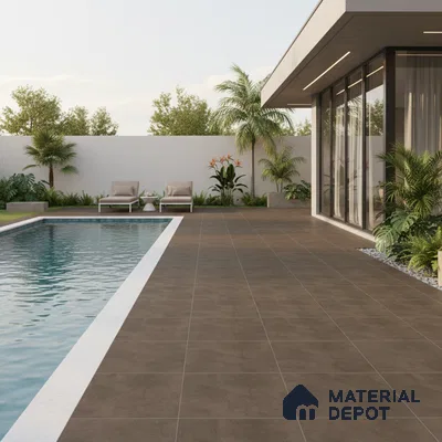Modern outdoor poolside with brown matte floor tiles and white pool coping
