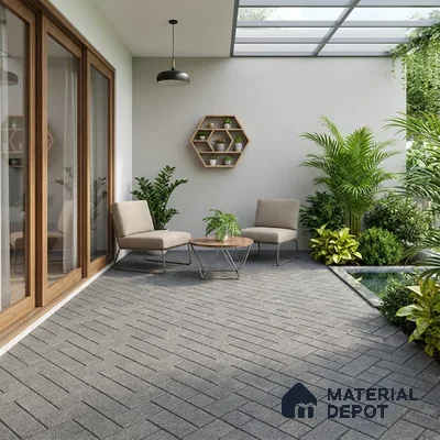 Modern outdoor seating with grey herringbone floor tiles and wooden accents