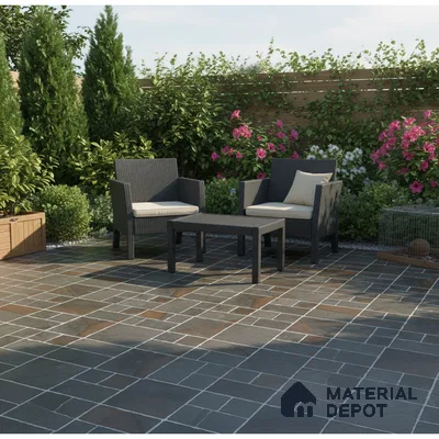 Modern outdoor patio with slate stone floor tiles and rattan furniture