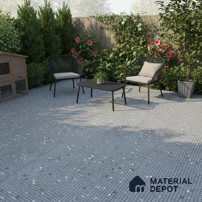 Modern outdoor seating with grey mosaic floor tiles and black rope chairs