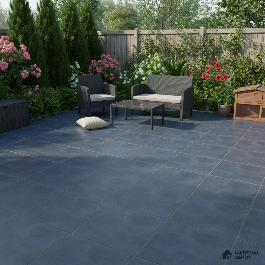 Modern outdoor patio with matte slate grey floor tiles and wicker furniture