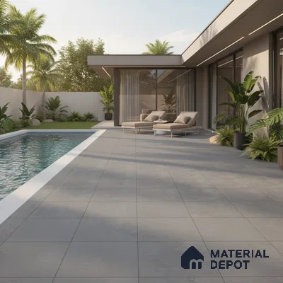 Modern outdoor poolside with large format grey stone tiles and minimalist landscaping