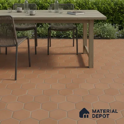Mediterranean outdoor space with terracotta hexagonal floor tiles and wooden dining table