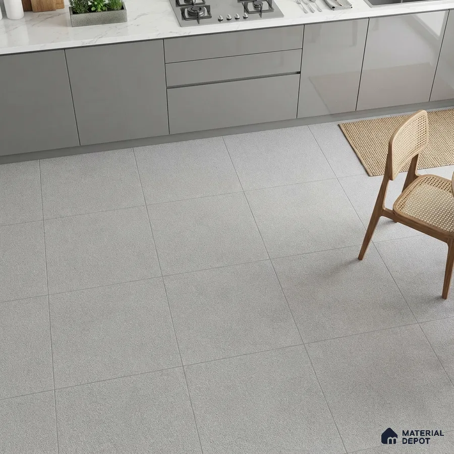 Modern kitchen with grey high gloss laminate cabinets, white marble countertop, and light grey matte floor tiles