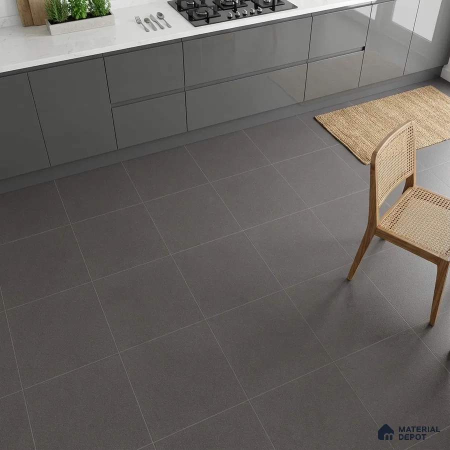 Modern kitchen with grey high gloss laminate cabinets, white marble countertop, and matte charcoal grey floor tiles