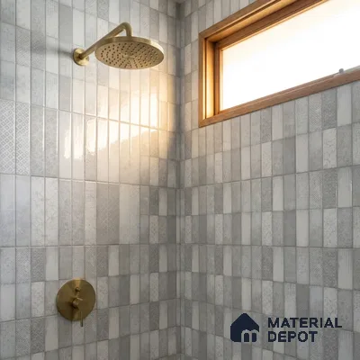 Modern Bathroom with Light Grey Patterned Stacked Tile and Brass Fixtures