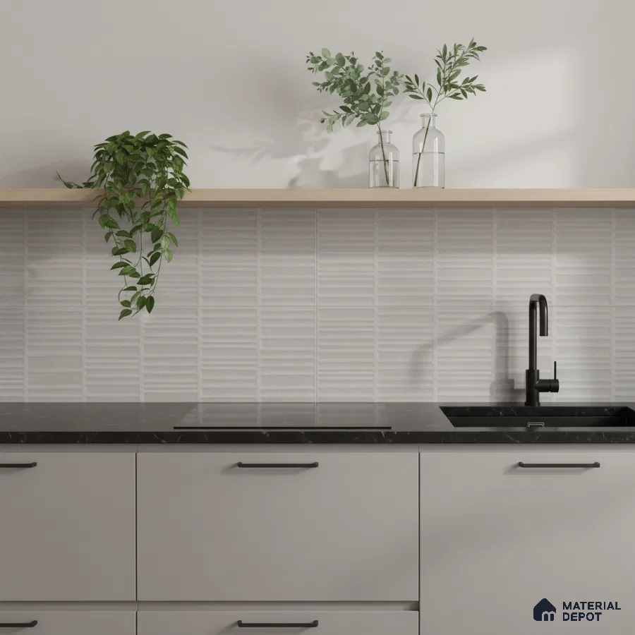 Minimalist kitchen with matte grey laminate cabinets, black marble countertop, and white textured subway backsplash tile