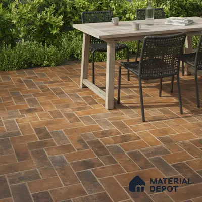 Modern outdoor patio with rustic terracotta herringbone floor tiles and wooden dining table