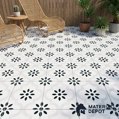 Scandinavian outdoor patio with black-and-white floral patterned floor tiles and rattan furniture