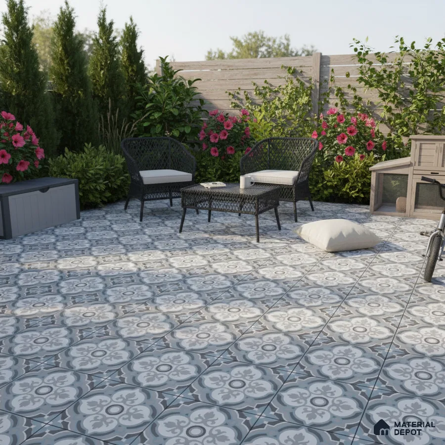 Mediterranean outdoor patio with blue and white patterned floor tiles and wicker furniture
