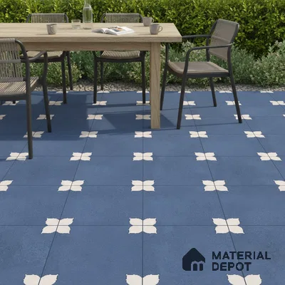 Modern outdoor dining with blue geometric patterned floor tiles and natural wood table