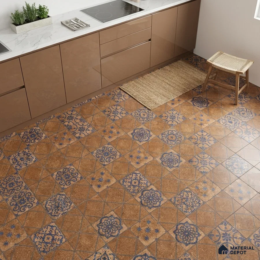 Modern kitchen with glossy taupe laminate cabinets, white marble countertop, and blue patterned terracotta floor tiles