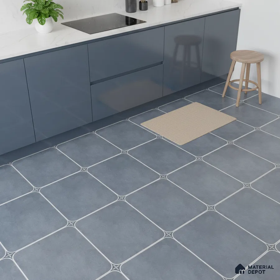 Modern kitchen with blue high gloss laminate cabinets, white marble-look quartz countertop, and blue geometric floor tiles