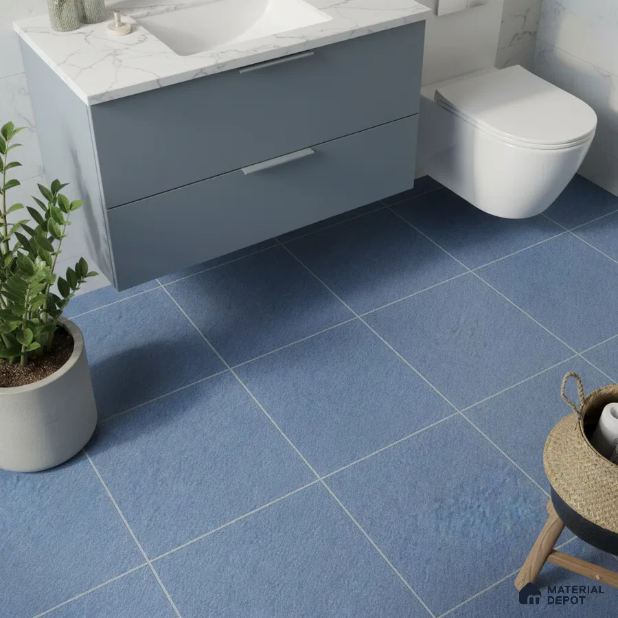 Modern bathroom with blue floor tiles, blue vanity laminate, and white marble countertop