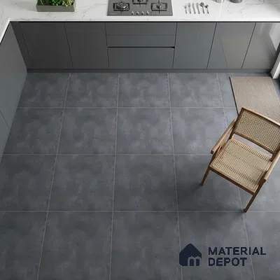 Modern kitchen with matte grey laminate cabinets, white marble-look quartz countertop, and charcoal grey stone-look floor tiles