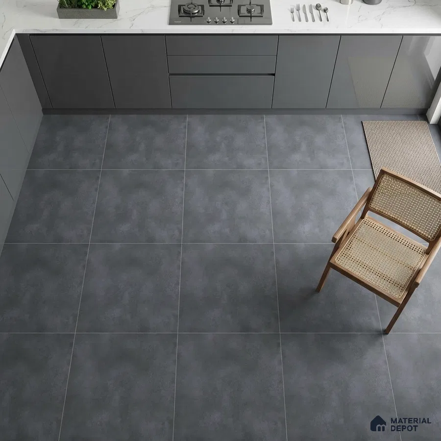 Modern kitchen with matte grey laminate cabinets, white marble-look quartz countertop, and charcoal grey stone-look floor tiles