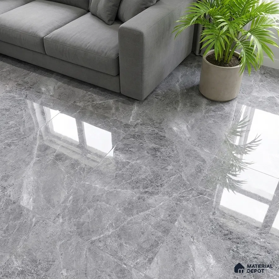 Modern living room with grey marble-look polished floor tiles and grey fabric sofa