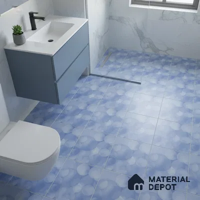 Modern bathroom with blue bubble patterned floor tiles and marble wall tiles