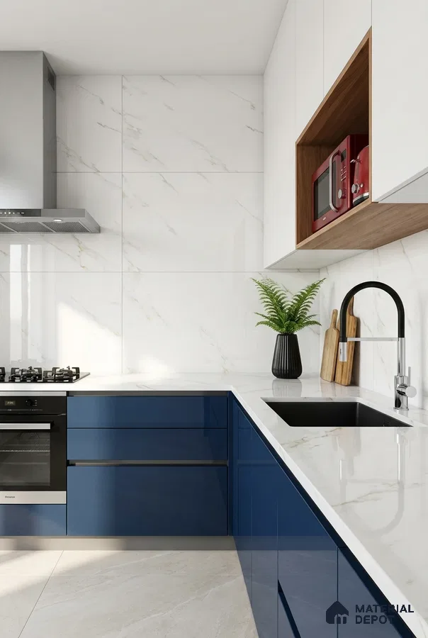 Modern kitchen with blue high gloss laminate, white marble-look backsplash tile, and white quartz countertop