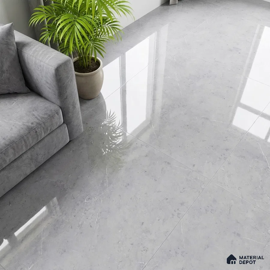 Modern living room with glossy light grey marble-look floor tiles and grey suede sofa