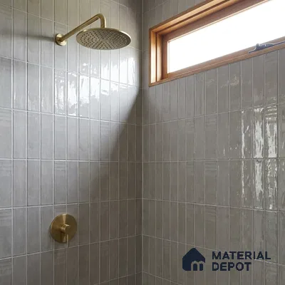 Modern Bathroom with Glossy Greige Vertical Subway Tile and Brass Fixtures