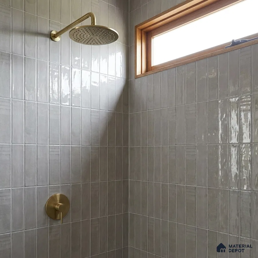 Modern Bathroom with Glossy Greige Vertical Subway Tile and Brass Fixtures