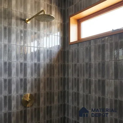 Industrial Bathroom with Glossy Charcoal Vertical Subway Tile and Brass Fixtures