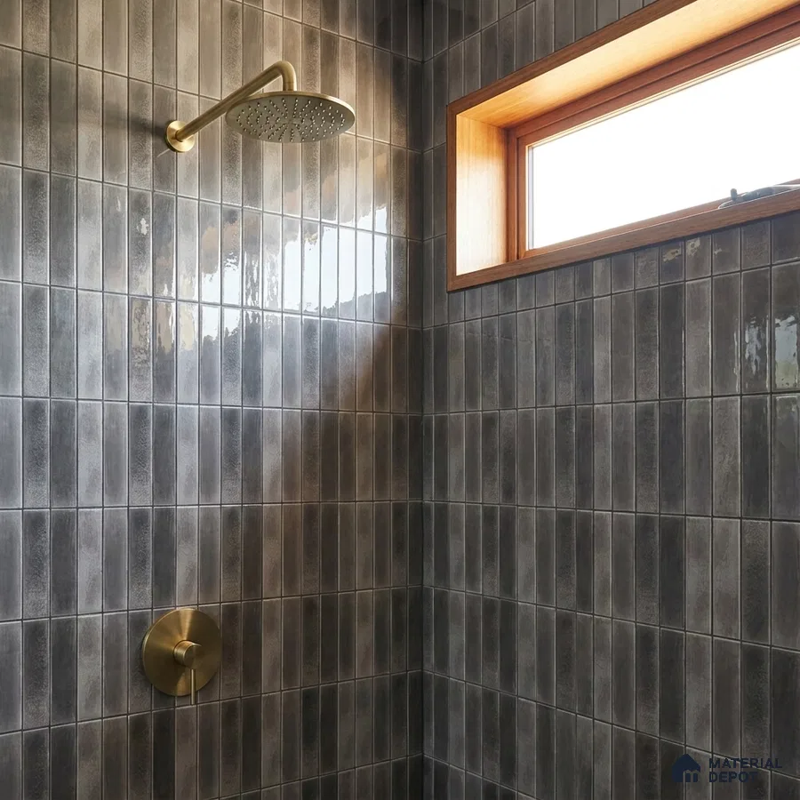 Industrial Bathroom with Glossy Charcoal Vertical Subway Tile and Brass Fixtures