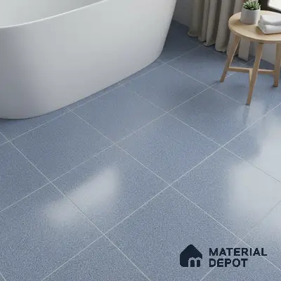 Minimalist bathroom with blue speckled floor tiles and freestanding tub