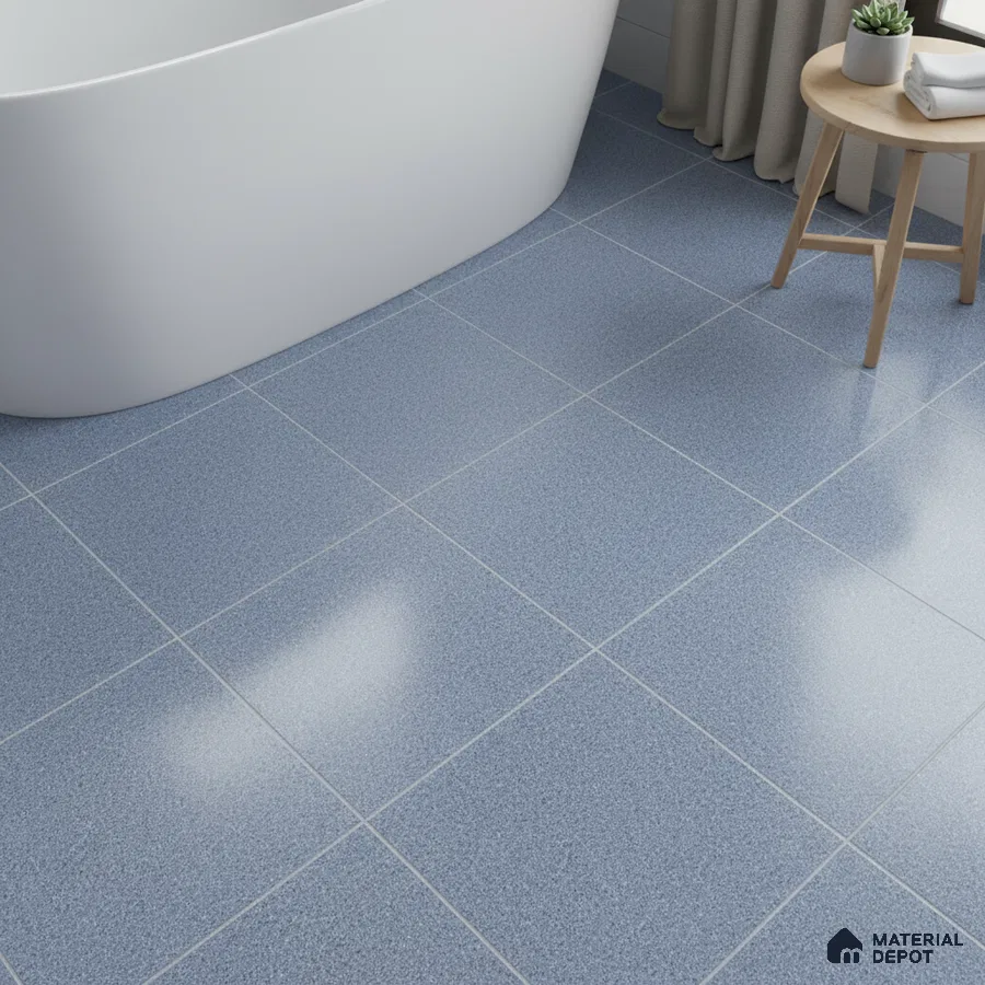 Minimalist bathroom with blue speckled floor tiles and freestanding tub