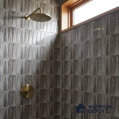 Industrial Bathroom with Glossy Grey 3D Geometric Textured Tile and Brass Fixtures