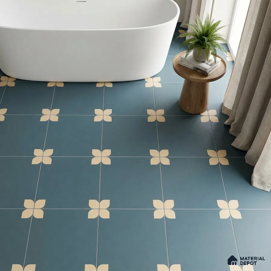 Modern bathroom with blue floral patterned floor tiles and freestanding tub