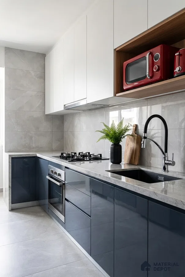 Modern kitchen with navy blue high gloss laminate, frosty white laminate, and grey marble-look backsplash tile