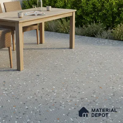 Modern outdoor space with grey terrazzo floor tiles and natural wood dining set