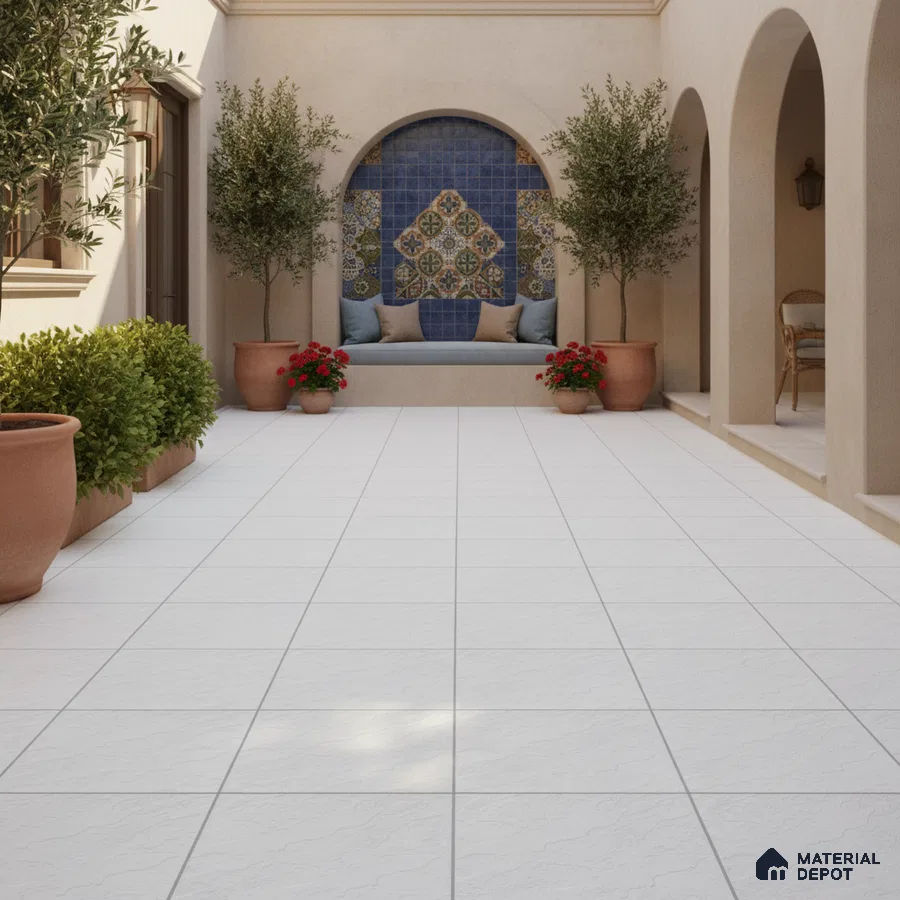 Mediterranean outdoor courtyard with white floor tiles and blue patterned wall tiles