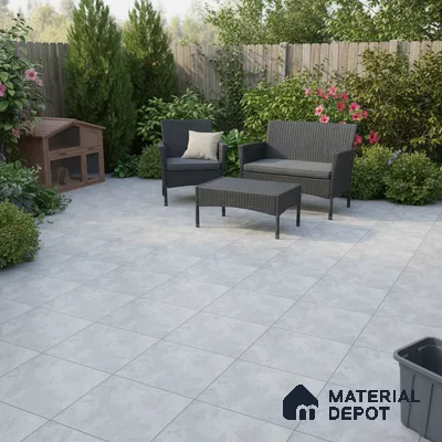 Modern outdoor patio with light grey stone-look floor tiles and rattan furniture