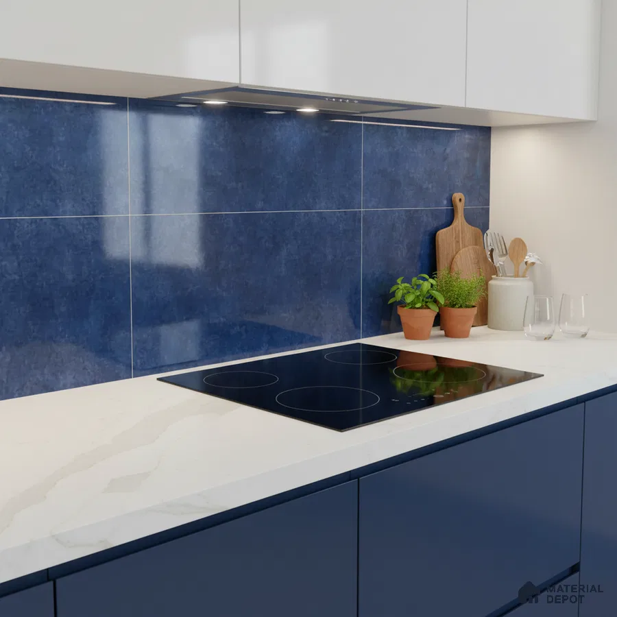 Modern kitchen with blue backsplash tile, navy blue laminate cabinets, and white marble-look quartz countertop