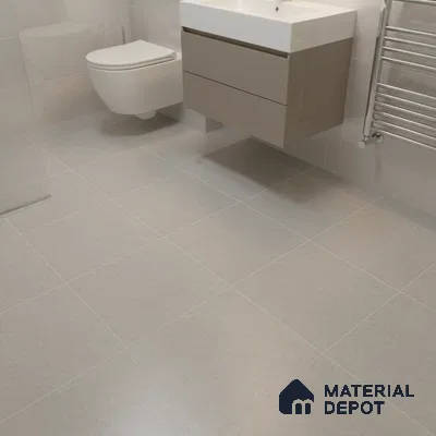 Minimalist bathroom with light grey matte tiles and taupe floating vanity