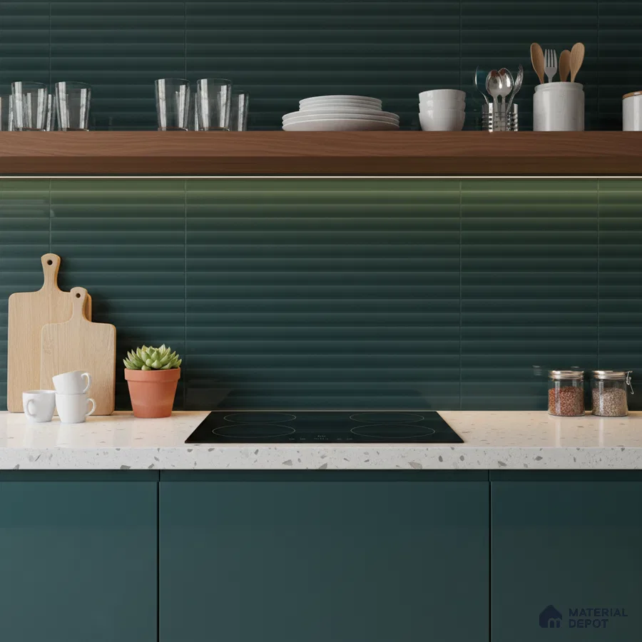 Modern kitchen with deep green fluted backsplash tile, terrazzo countertop, and matte green laminate cabinets