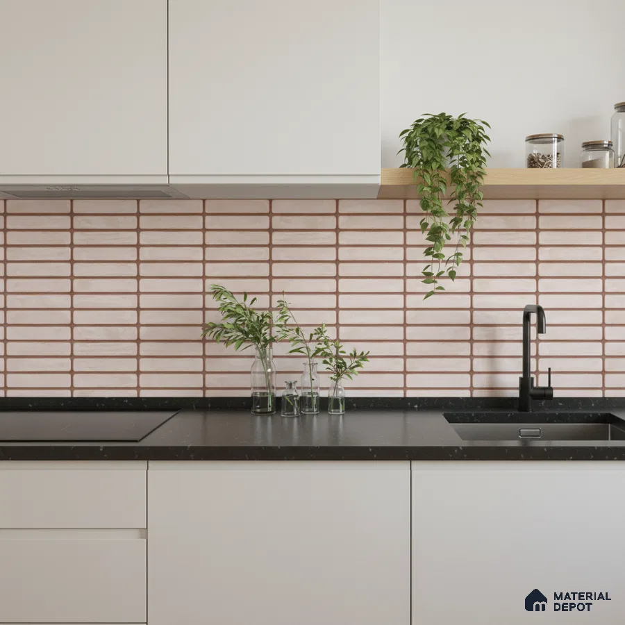 Minimalist kitchen with frosty white laminate cabinets, black quartz countertop, and blush pink kitkat subway backsplash tiles