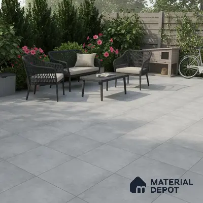 Modern outdoor patio with light grey stone-look floor tiles and wicker furniture