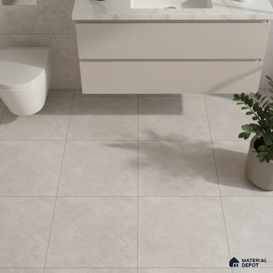 Minimalist bathroom with light grey stone floor tiles and marble-look countertop