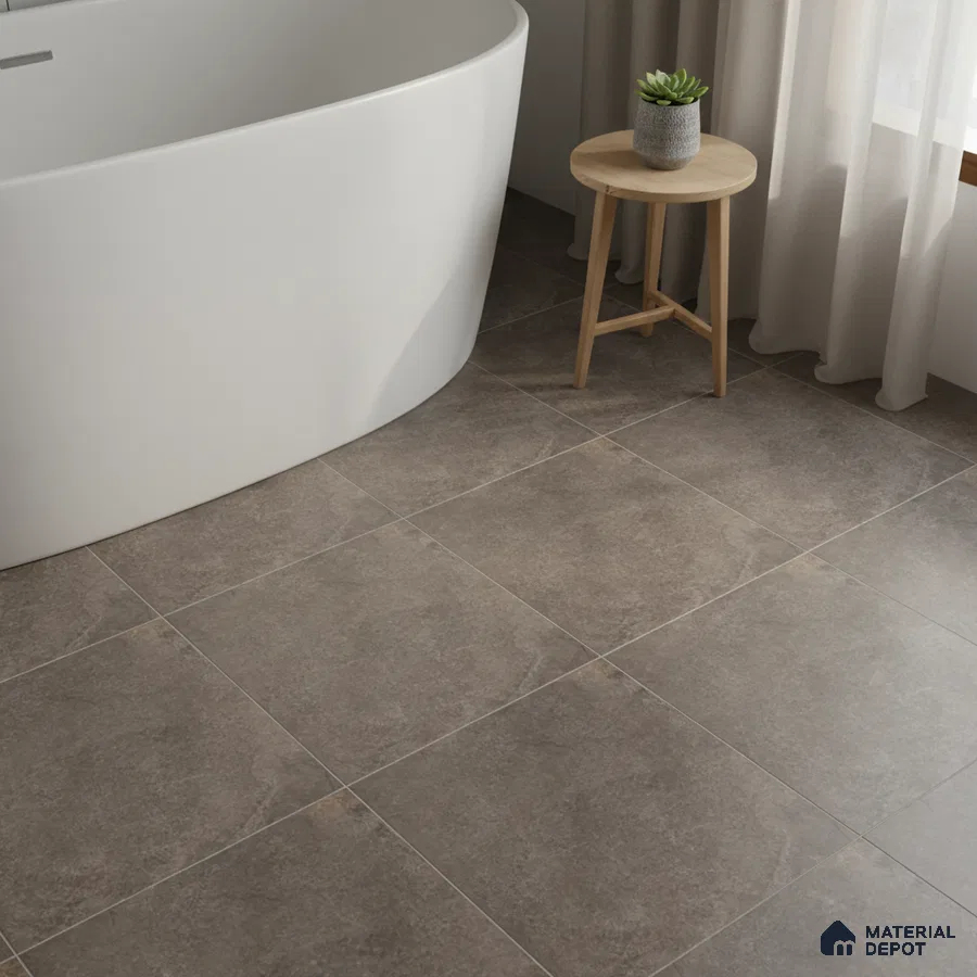 Minimalist bathroom with matte stone-look grey floor tiles and freestanding tub