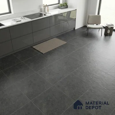 Modern kitchen with glossy grey laminate cabinets, white marble-look countertop, and charcoal stone floor tiles