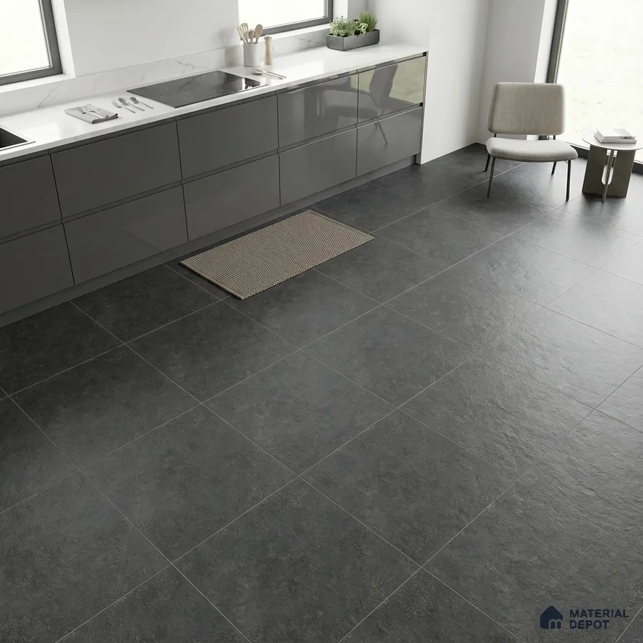 Modern kitchen with glossy grey laminate cabinets, white marble-look countertop, and charcoal stone floor tiles