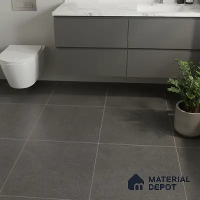 Minimalist bathroom with matte grey floor tiles and marble-look countertop vanity