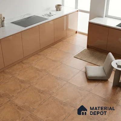 Modern kitchen with glossy beige laminate cabinets and marble countertop with terracotta floor tiles