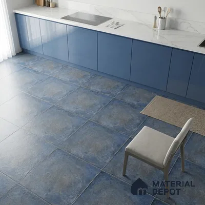 Modern kitchen with blue high gloss laminate cabinets, white marble-look countertop, and blue stone-look floor tiles