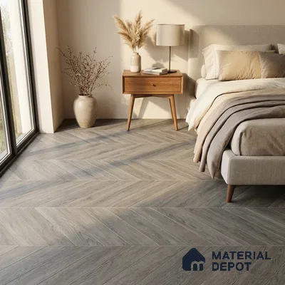 Scandinavian bedroom with grey chevron wood flooring and beige upholstered bed
