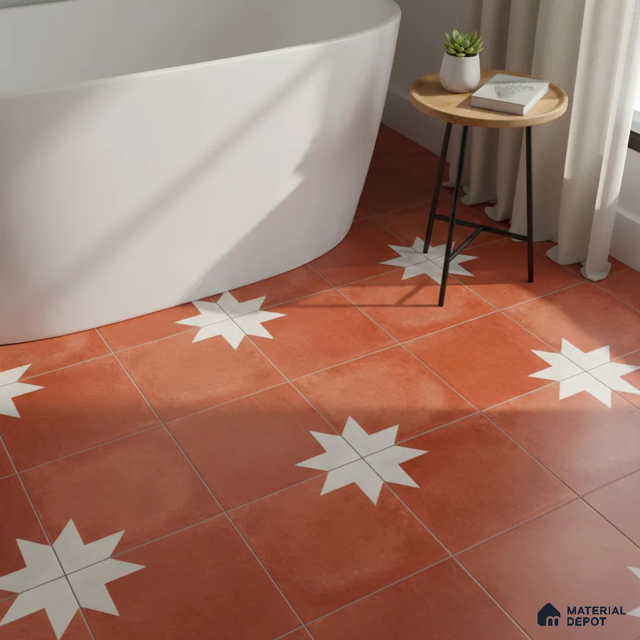Modern bathroom with terracotta star patterned floor tiles and freestanding tub